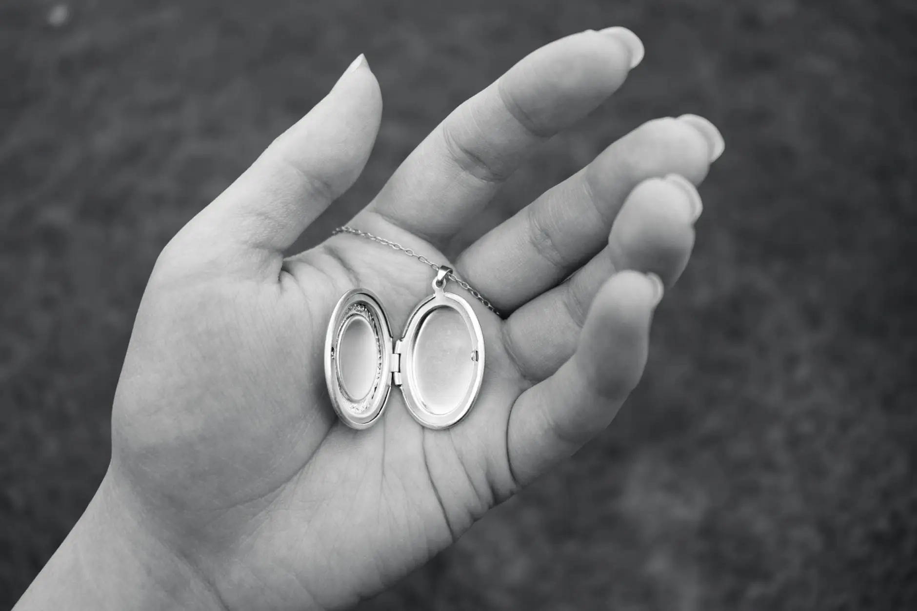 Open locket held in hand as a memorial jewellery keepsake for Evaheld Me — visual about Memorial Jewellery: Meaning, Types and How to Choose for Memorial Jewellery by Evaheld Memorials