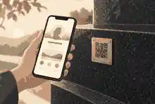 Phone opening a QR-linked memorial beside a granite plaque