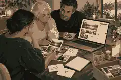Relatives reviewing photographs and tribute notes together