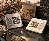 Outdoor QR memorial plaque material samples beside granite