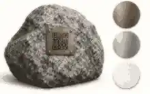 Outdoor memorial plaque materials beside granite