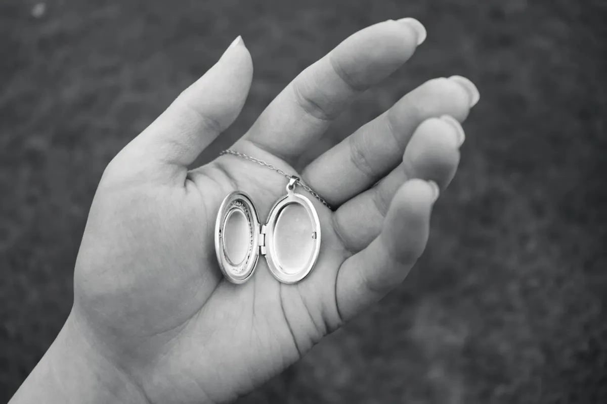 Open locket held in hand as a memorial jewellery keepsake for Evaheld Memorials — featured visual for Memorial Jewellery: Meaning, Types and How to Choose by Evaheld Memorials