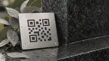 how long does stainless steel last outside: Stainless QR plaque material sample beside granite