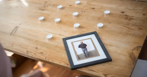 The stages of grief remembrance photo and candles Evaheld Memorials — featured visual for The Stages of Grief: What They Really Mean Explained by Evaheld Memorials