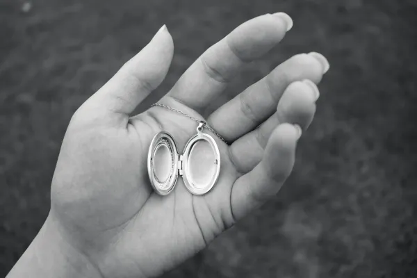 Open locket held in hand as a memorial jewellery keepsake for Evaheld Memorials — featured visual for Memorial Jewellery: Meaning, Types and How to Choose by Evaheld Memorials