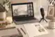 how much does a zoom funeral cost: Funeral livestream setup with laptop and microphone